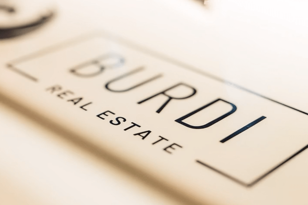 Close up of Burdi Real Estate plaque